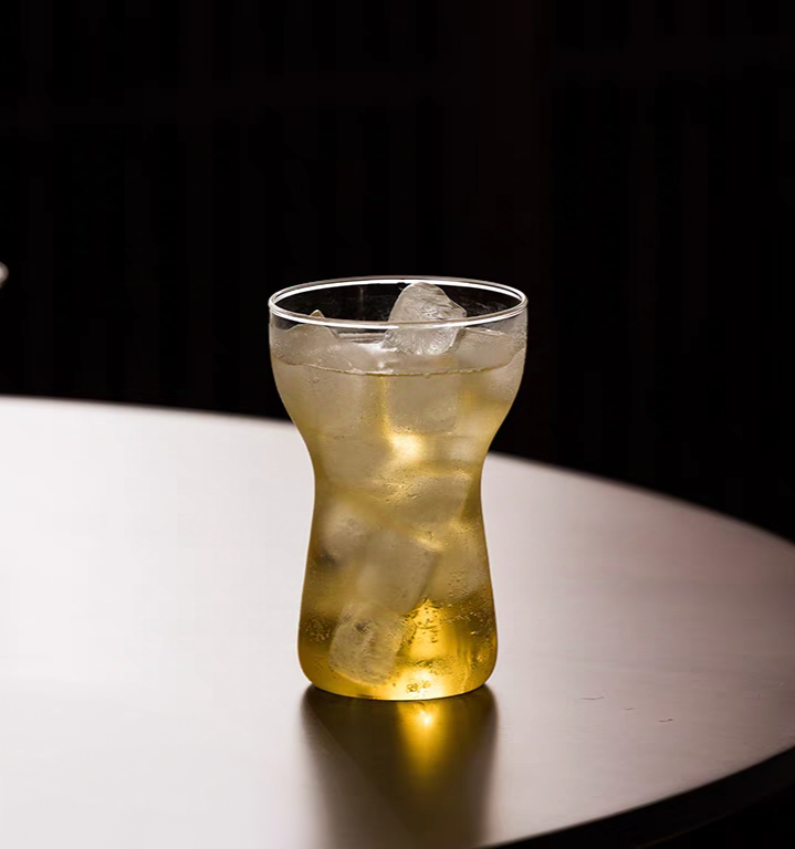 Modern tall glass cup showcasing beverage, combining simplicity with elegance.  Perfect for Matcha, Lemonade, cocktail, and more.