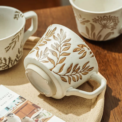 Handcrafted ceramic mug with a subtle bean leaves design, perfect for coffee or tea in Japandi, cottage, Nordic or minimalist interiors.