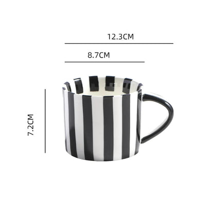 Hand-Painted ceramic mug with a black stripe design, perfect for coffee or tea in modern, Nordic or minimalist interiors.