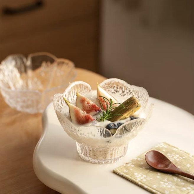 Clear floral glass bowl filled with fresh salad, blending functionality with an elegant, modern design.