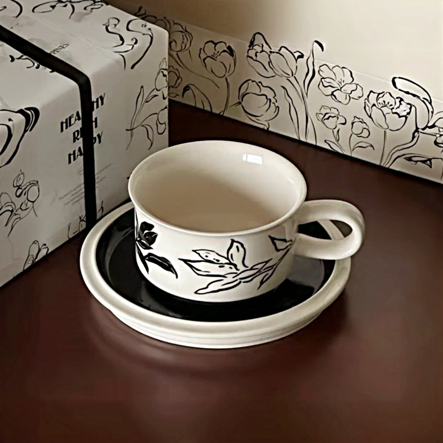 A chic ceramic cup featuring black and white patterns and a smooth glaze, perfect for modern home decor.