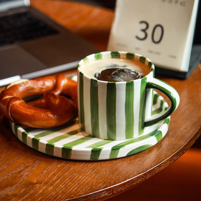 Nordic-inspired ceramic cup and plate set with hand-painted green grass stripes, ideal for serving coffee, tea, and desserts, blending modern and minimalist design.