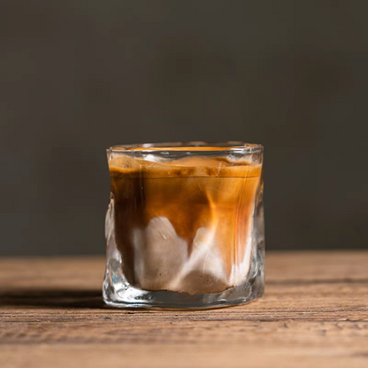 A 200ml transparent glass with a wavy design, perfect for coffee aesthetics , espresso and modern interiors.