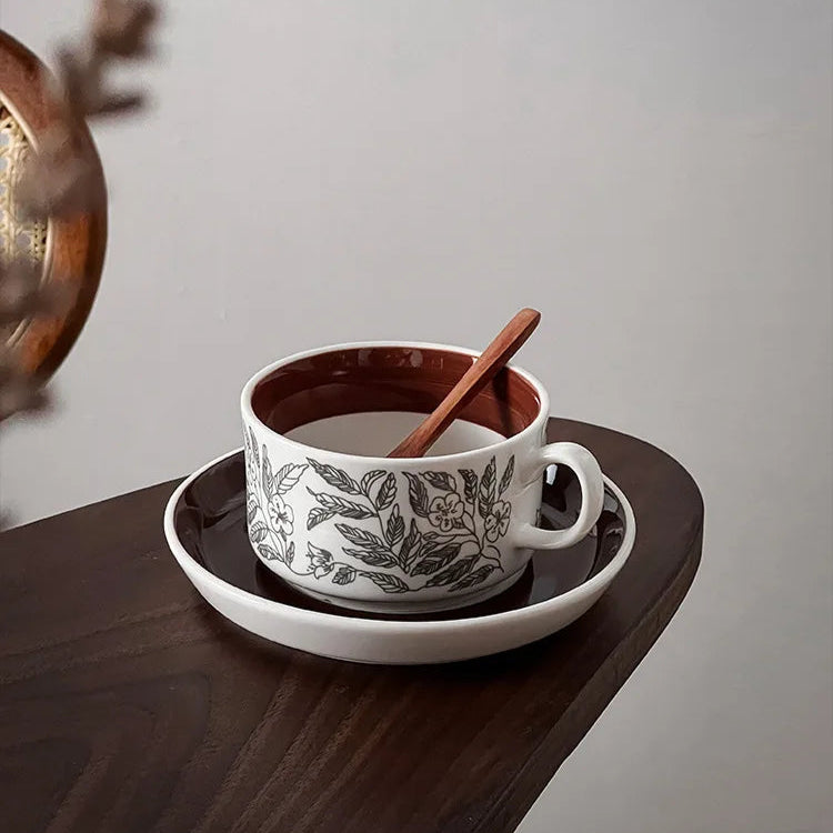 A minimalist ceramic cup with dedicate nature-inspired leaf pattern, great for tea or coffee.