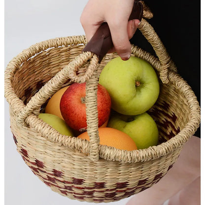 Seaweed round storage basket with handle, holding various fresh fruits, adding a natural, minimalist touch.