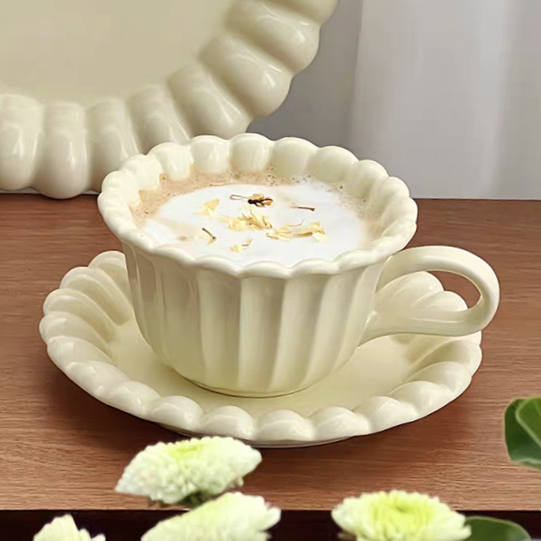 Cream white ceramic coffee cup set with floral accents, perfect for minimalist and neutral interior design styles.