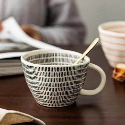 Neutral ceramic coffee mug with a simple yet elegant dot design. Perfect for  iced or hot beverages