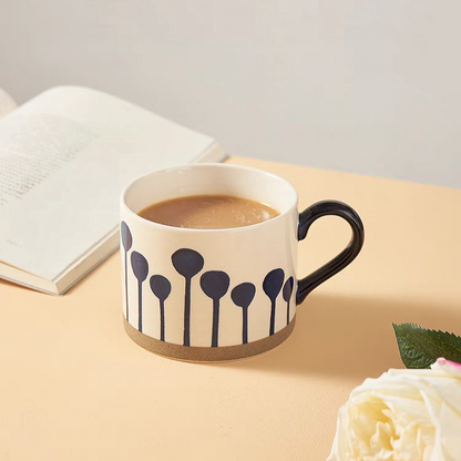 Nordic-inspired design and hand-painted motifs of the 450ml ceramic mug, perfect for daily and decorative use.