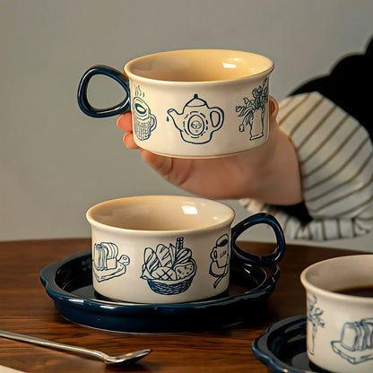 Artistic pottery cup featuring blue bakery illustrations, ideal for cozy tea or latte moments. Perfect gift for her (under $30).