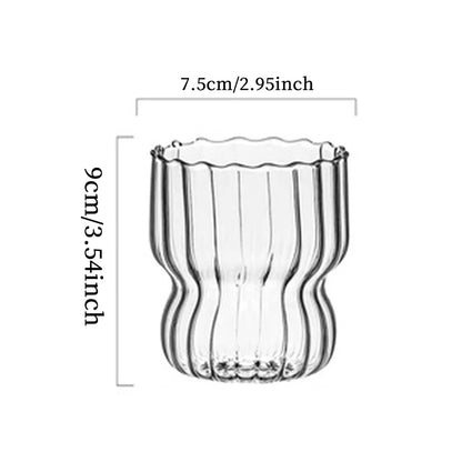 A clear ribbed drinking glass with precise dimensions, 3.54 Inches Tall, 2.96 Inches Wide, perfect for milk, coffee, or juice in minimalist interiors.