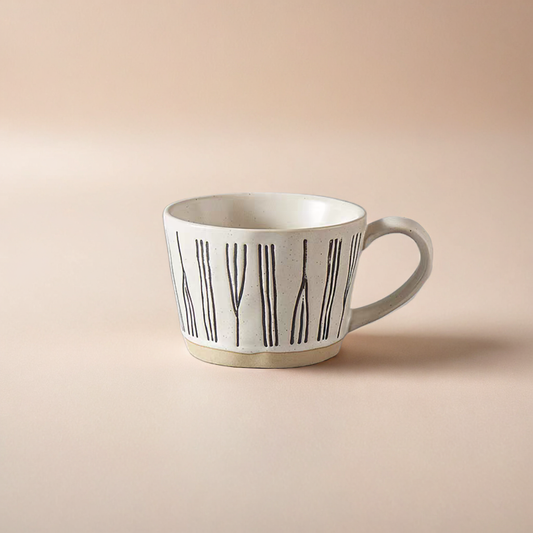 Hand-crafted ceramic mug with a smooth textured surface, featuring a Nordic abstract pattern, ideal for coffee and tea lovers. 