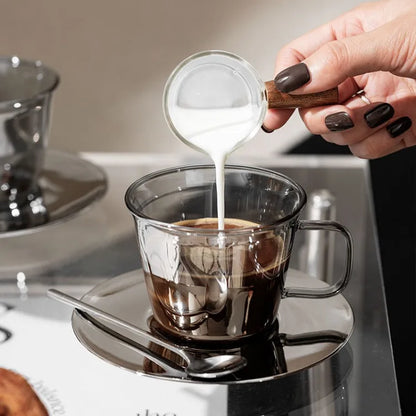 High-quality silver glass coffee cup filled with milk coffee, highlighting its sophisticated and modern style.