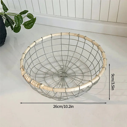 Close-up of the small round woven metal wire storage basket, highlighting its eco-friendly rattan design and spacious size suitable for various storage needs.