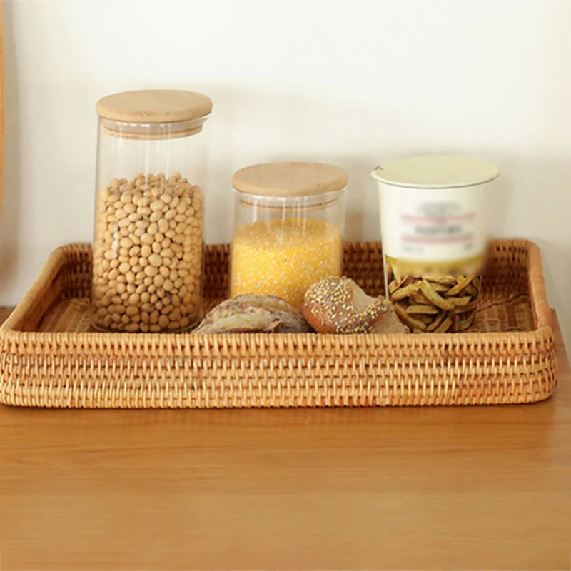 Natural rattan storage tray used for holding dried fruits and snacks, perfect for dining room use