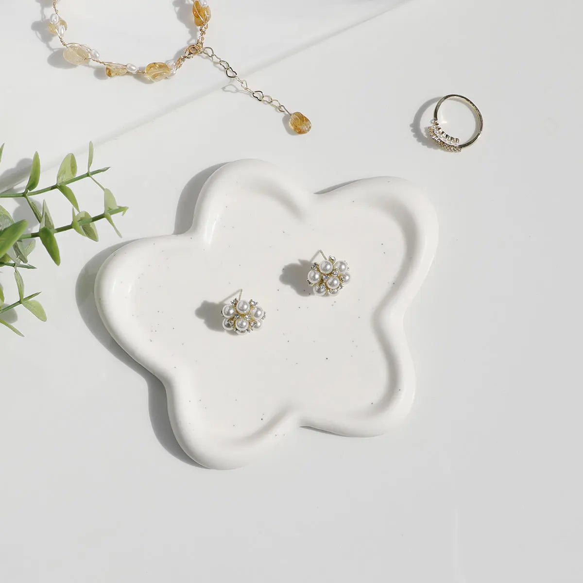 White ceramic star-shaped decorative tray, showcasing modern design and smooth finish, perfect for jewellery and key organization.