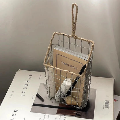 Overall view of the hanging woven metal wire storage basket, showcasing its elegant design and functionality, perfect for various home decor styles.