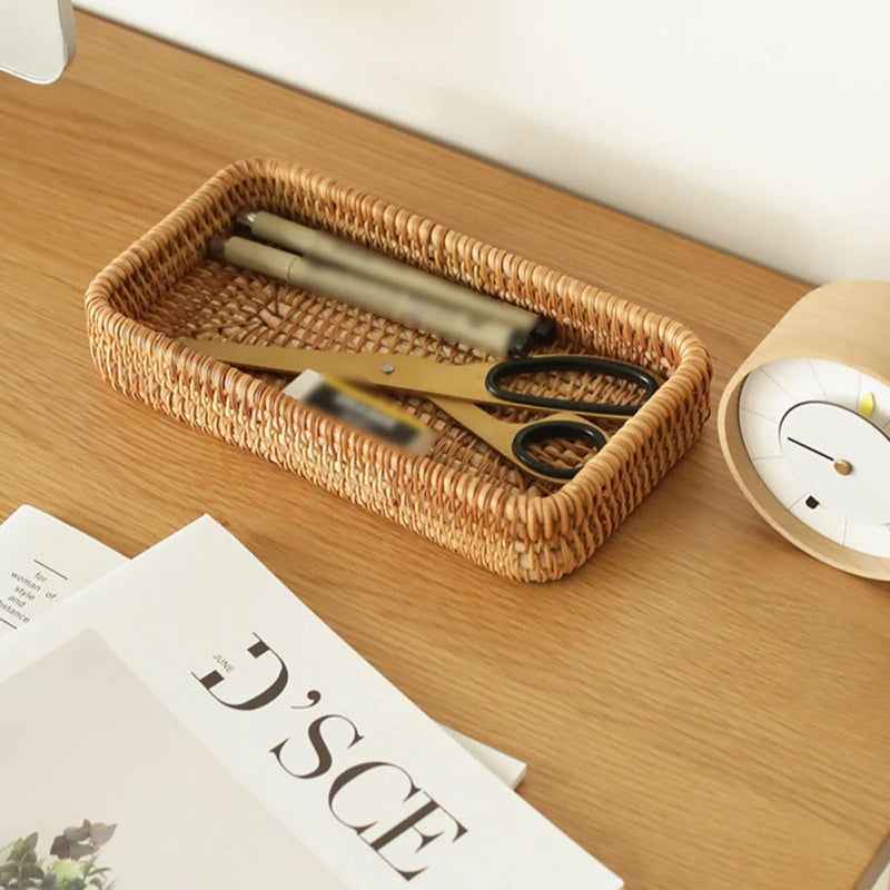 Rectangle rattan storage tray keeping stationery and office supplies organized on a desktop