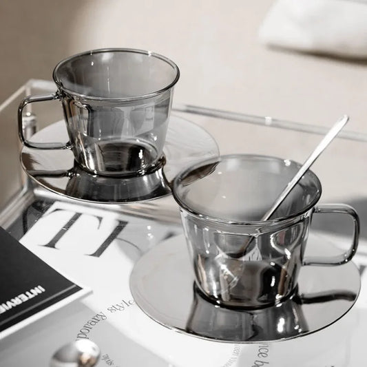 Silver glass coffee cup placed on a table, showcasing its minimalist and aesthetic appeal