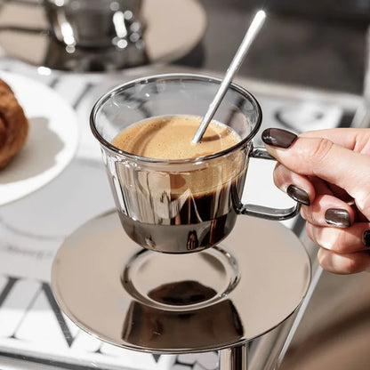 Premium silver glass coffee cup filled with a creamy latte, showcasing its elegant aesthetics and minimalist design.