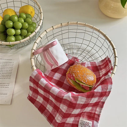 Decorative round woven basket with snacks, blending metal and rattan for a stylish and functional storage solution.