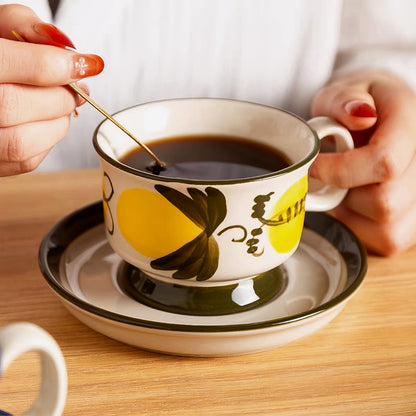 Elegant ceramic cup resting on a 14.3 cm (5.63 inches) saucer with a matching floral design, highlighting Scandinavian simplicity.