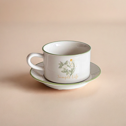 A Daisy design ceramic cup paired with a matching plate for elegant drinkware.