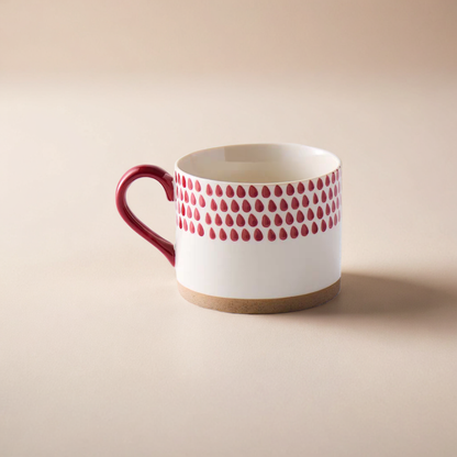 Scandinavian-style red and white mug with a textured design, perfect for iced or hot beverages.