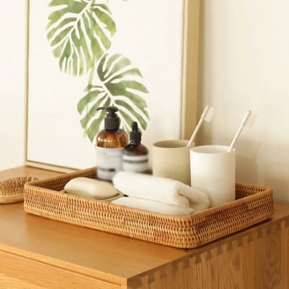 Eco-friendly rattan tray storing toiletries and bathroom accessories, offering creative storage ideas