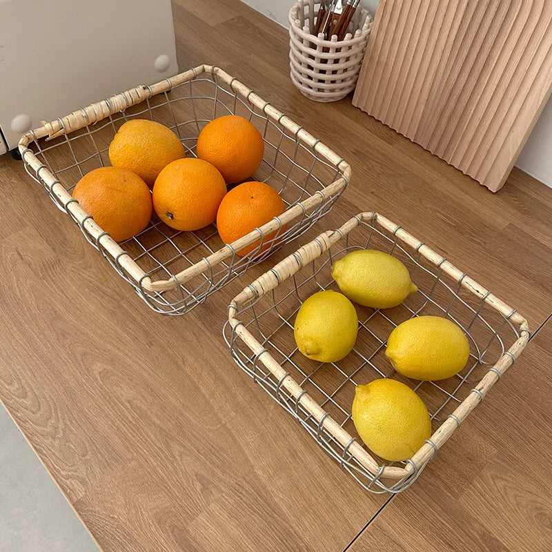 Warm minimalism metal wire basket with a variety of fruits, perfect for adding aesthetic value to your kitchen.