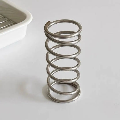 High-quality metal brush holder with a unique spiral design, suitable for contemporary, classic, and minimalist home decor.