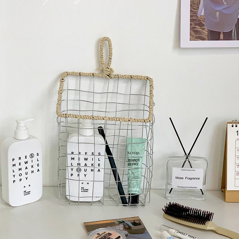 Complete view of the hanging woven metal wire storage basket, featuring its durable metal frame and woven paper rope, ideal for Scandinavian and natural-inspired interiors.