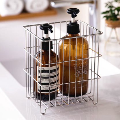 Showcasing the basket’s stylish design while holding essential items like toiletries and cosmetics in a clean, minimalistic way.