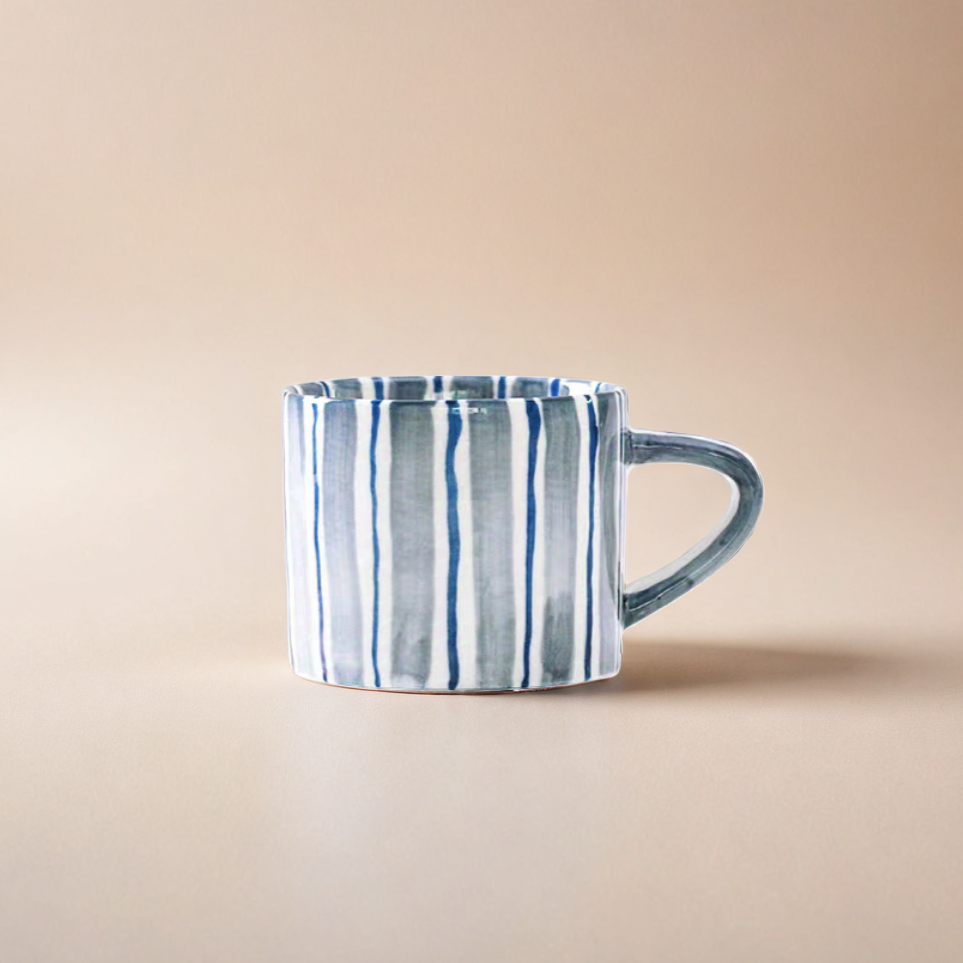 Chic striped ceramic cup and plate set with a modern cerulean blue color scheme,  craft from premium ceramic, ideal for creating an elegant and stylish table setting.