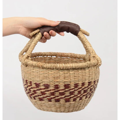 Nordic style natural seaweed woven basket with handle, offering eco-friendly and stylish storage solutions for any room.