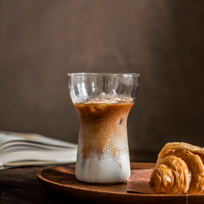  400ml transparent glass with a curved design, filled with a rich latte, perfect for coffee aesthetics.