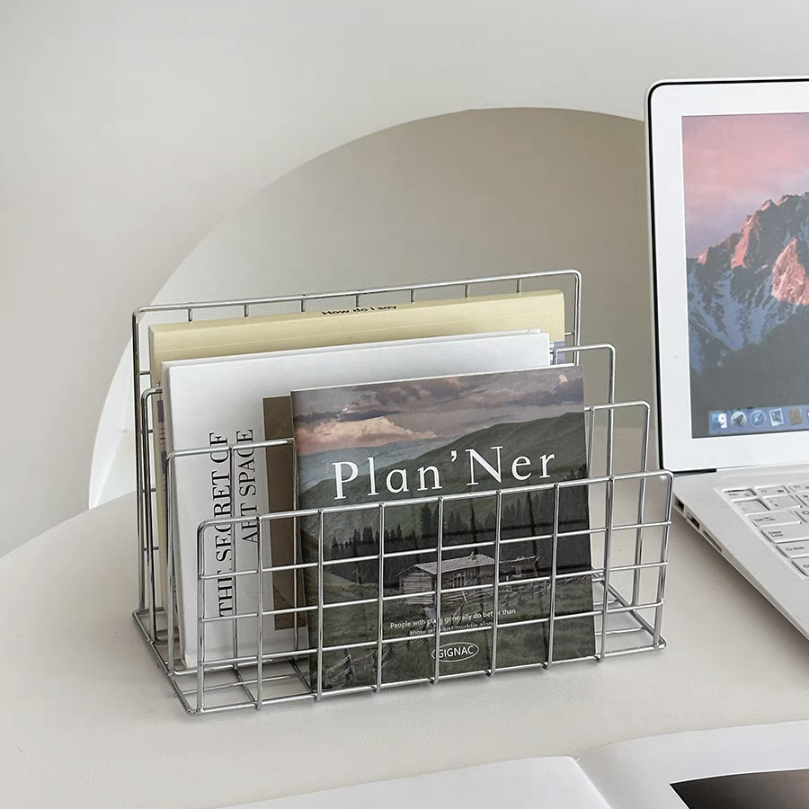 Organizing books and magazines with a sleek metal design, perfect for minimalist and Scandinavian interiors.