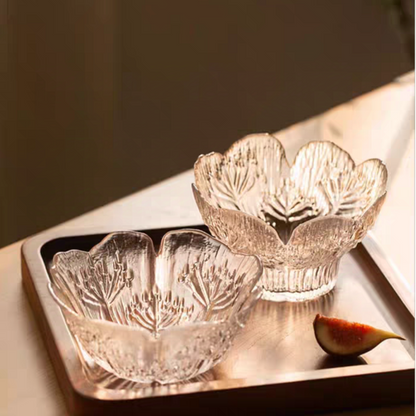 Petal embossed glass dessert bowl with a floral pattern and clear material, showcasing minimalist and contemporary style.