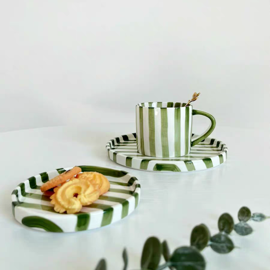 Multi-functional ceramic cup and plate set with vibrant green grass stripes, designed in minimalist Nordic style, perfect for serving drinks, cakes, and pastries.