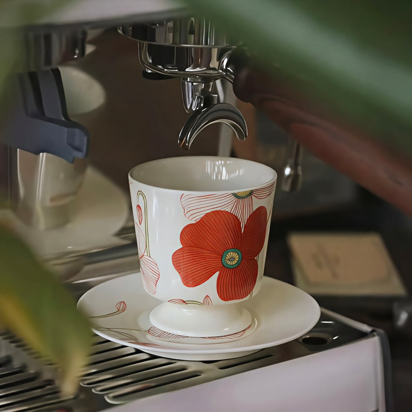 Hand-painted red poppy ceramic cup with a matching saucer, perfect for coffee or tea lovers. Craft from durable and premium ceramic.
