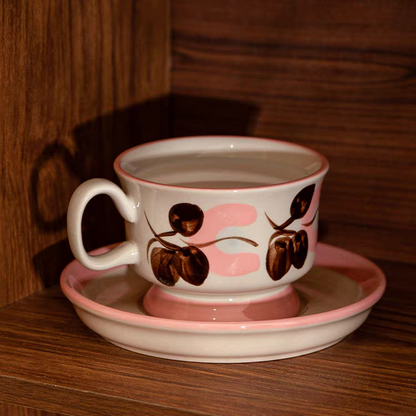 A retro-chic ceramic tea cup with an elegant fruit pattern. Made from high-quality ceramic for long-lasting durability. Ideal for serving coffee, tea, milk, or hot chocolate.