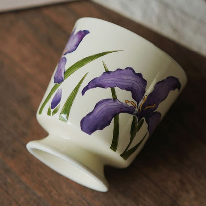 This Nordic Style ceramic mug features hand-painted purple iris flowers on a smooth glazed surface, ideal for Scandinavian or minimalist interiors.