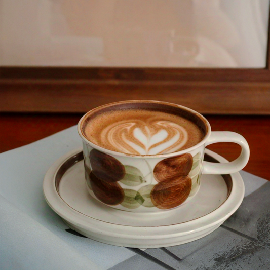 A hand-painted ceramic coffee cup featuring artistic brushstrokes, perfect for Scandinavian-inspired tableware. Dishwasher and microwave safe.