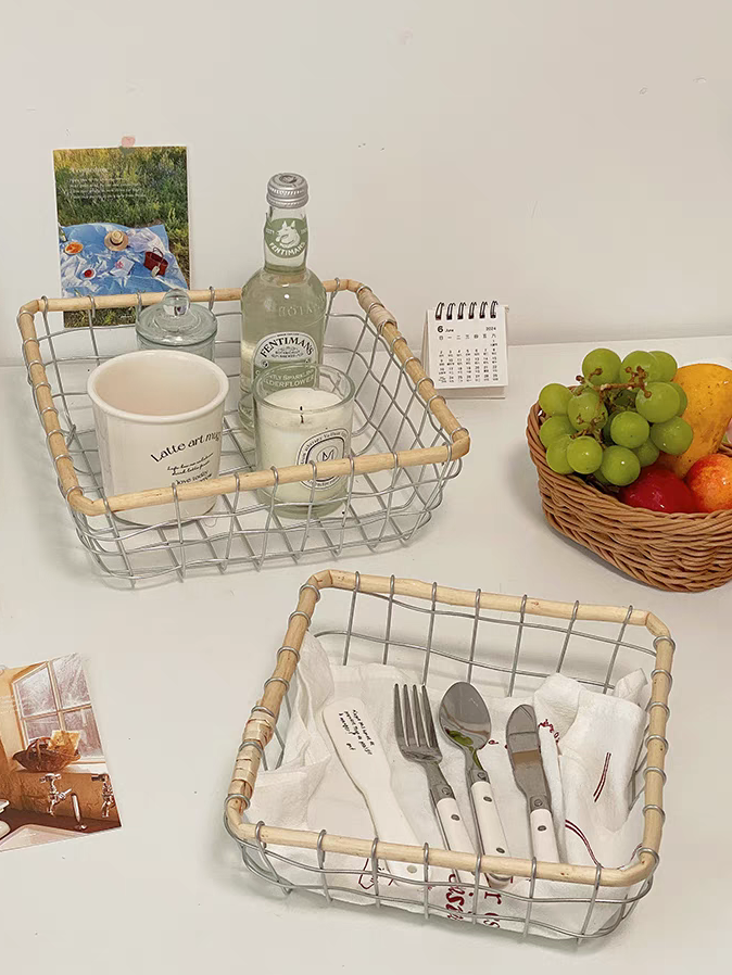 Square metal wire basket with tableware and beverages, perfect for Scandinavian decoration and warm minimalism kitchens.