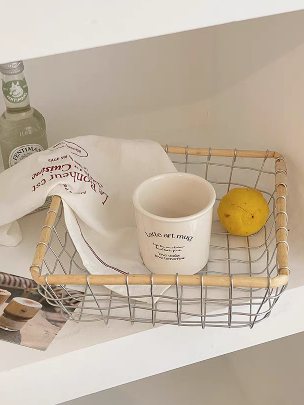 Decorative square woven basket filled with lemon and cups, emphasizing its practical and aesthetic value in Scandinavian minimalism decor.