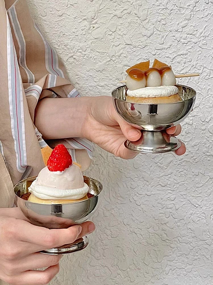 Desserts served in a stainless steel dish, highlighting its sleek, modern appearance and aesthetic appeal.