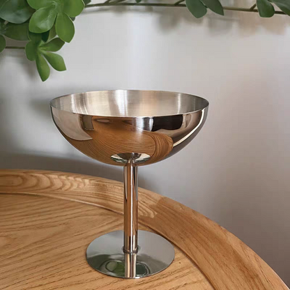 Stainless steel dessert goblet with a shiny silver finish and tall foot, perfect for modern décor, ideal for café serving.