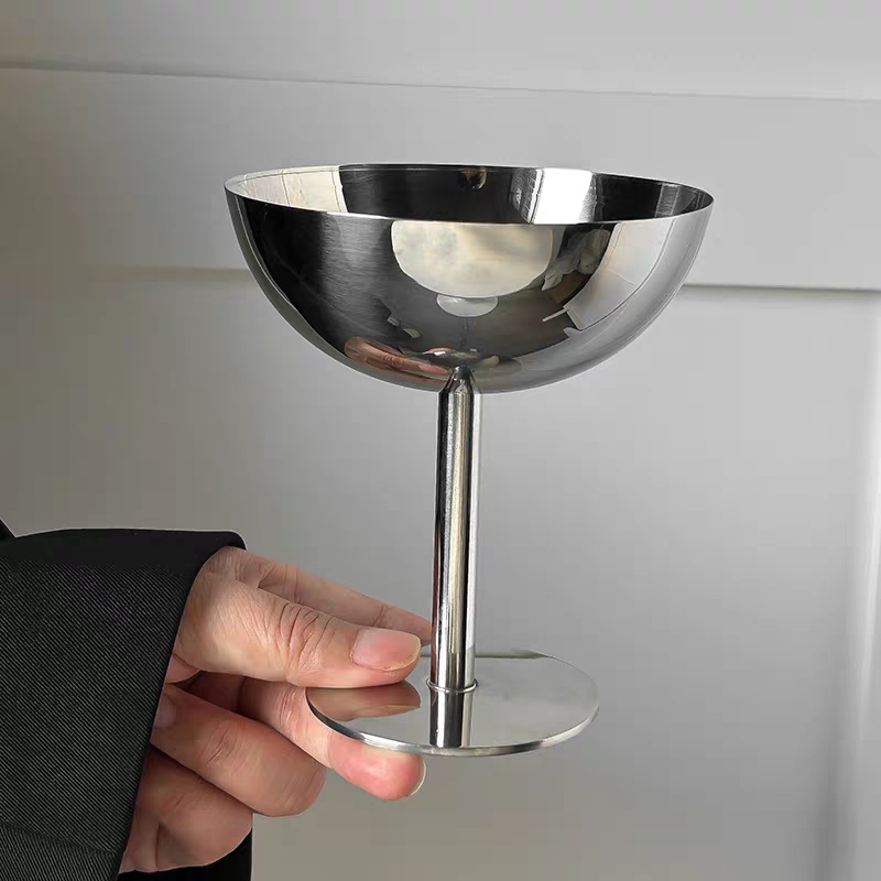 Goblet with silver finish serving fresh fruit, ideal for a modern kitchen or living room